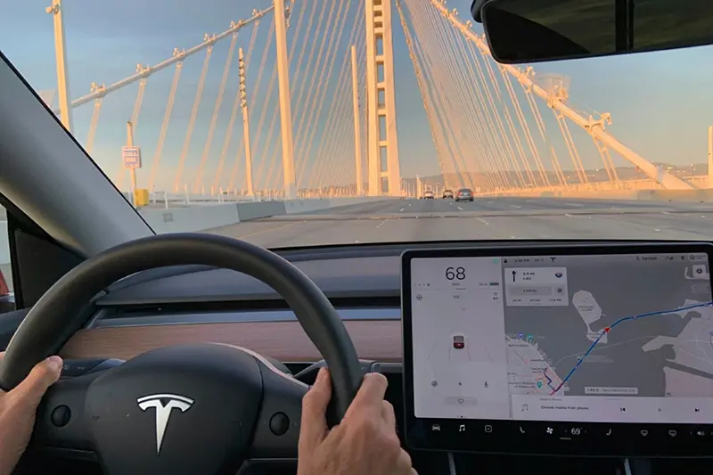 This photo provided by Edmunds shows the interior a 2020 Tesla Model Y while driving on the highway. (Courtesy of Edmunds via AP)