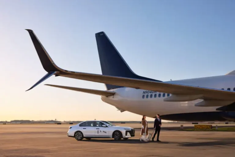 A couple steps off the tarmac beside a parked commercial jet, greeted by a luxury sedan featuring the 'PS' logo.