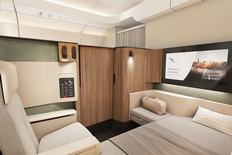 The enclosed first class cabin features an 80” (2m) long flat bed and separate reclining armchair. Photo: Qantas