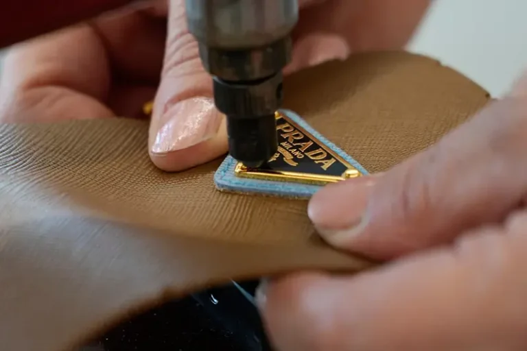 A leather good operator works at the Prada factory in Scandicci, Italy, Friday, Nov. 28, 2025. (AP Photo/Gregorio Borgia, File)