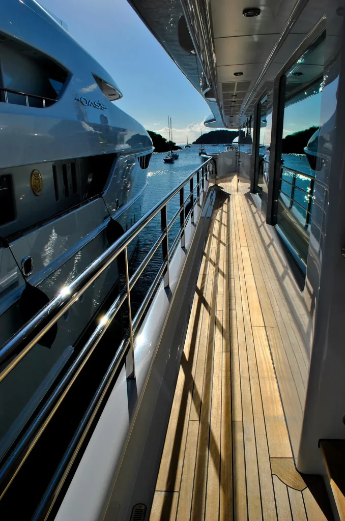 Photo of a yacht deck in a slip next to another yacht. Image by Lisa Larsen