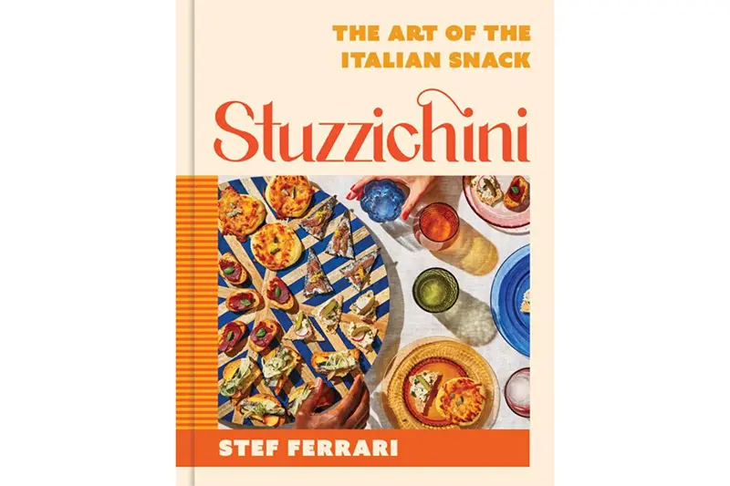 This cookbook cover image released by Voracious shows “Stuzzichini,” by Stef Ferrari. (Voracious via AP)