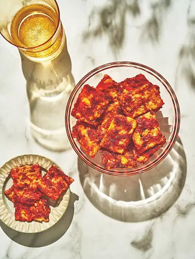 This image released by Voracious shows a recipe for Schiacciata, a versatile Tuscan bread, from the cookbook “Stuzzichini,” by Stef Ferrari. (Voracious via AP)