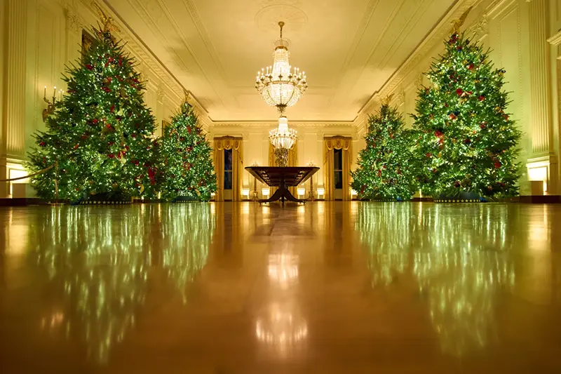 Christmas trees decorate the East Room of the White House during a press preview of the Christmas decorations “Home is Where the Heart Is,” Monday, Dec. 1, 2025, in Washington. (AP Photo/Evan Vucci)
