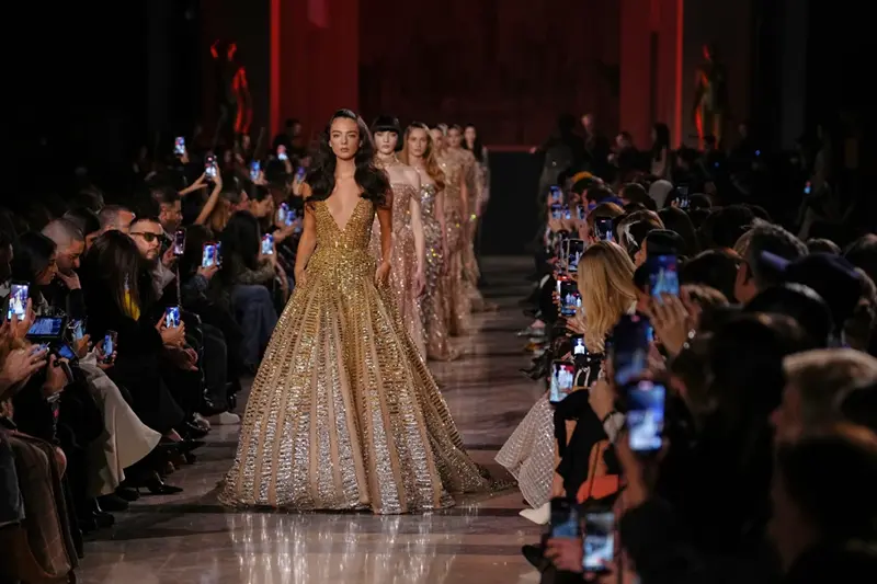 Models wear creations as part of the Elie Saab Spring/Summer 2026 Haute Couture collection presented in Paris, Wednesday, Jan. 28, 2026. (AP Photo/Aurelien Morissard)