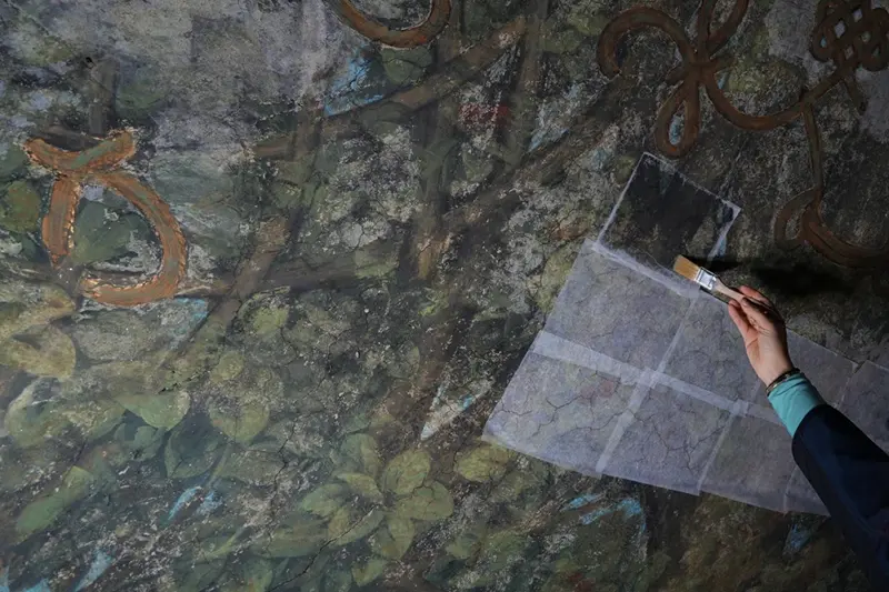 Marina Vece works on restoring the Sala delle Asse, part of the newly created Leonardo da Vinci itineraries inside Milan’s Sforza Castle, Italy, Tuesday, Jan. 20, 2026. (AP Photo/Antonio Calanni)