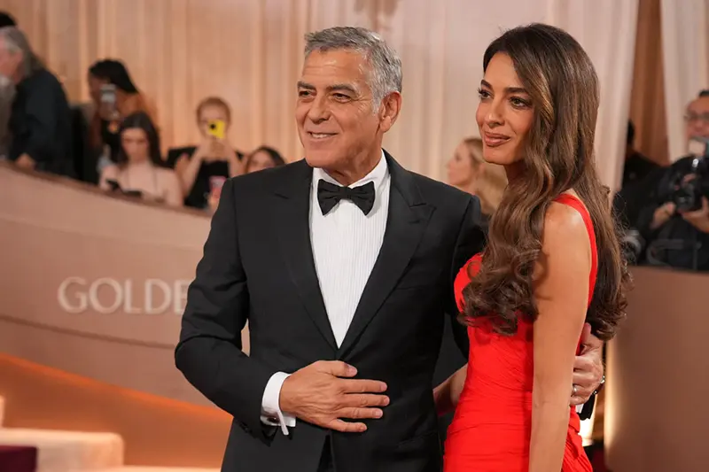George Clooney, left, and Amal Clooney arrive at the 83rd Golden Globes on Sunday, Jan. 11, 2026, at the Beverly Hilton in Beverly Hills, Calif. (Photo by Jordan Strauss/Invision/AP)
