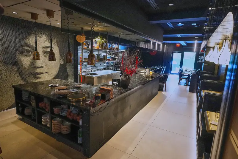 A mosaic likeness of owner Bolun Yao’s grandmother Yingtao, for whom his establishment is named, adorns a wall at Michelin-starred Chinese restaurant in New York, Tuesday, Jan. 27, 2026. (AP Photo/Richard Drew)