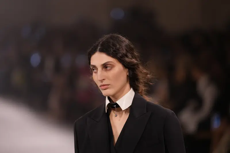 A model wears a creation from the Fendi Fall/Winter 2026-2027 Women’s collection presented in Milan, Italy, Wednesday, Feb. 25, 2026. (AP Photo/Antonio Calanni)