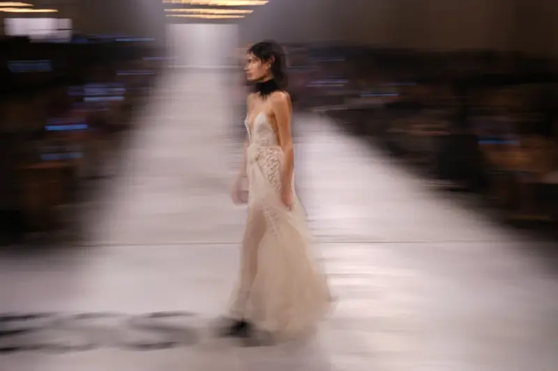 A model wears a creation from the Fendi Fall/Winter 2026-2027 Women’s collection presented in Milan, Italy, Wednesday, Feb. 25, 2026. (AP Photo/Antonio Calanni)