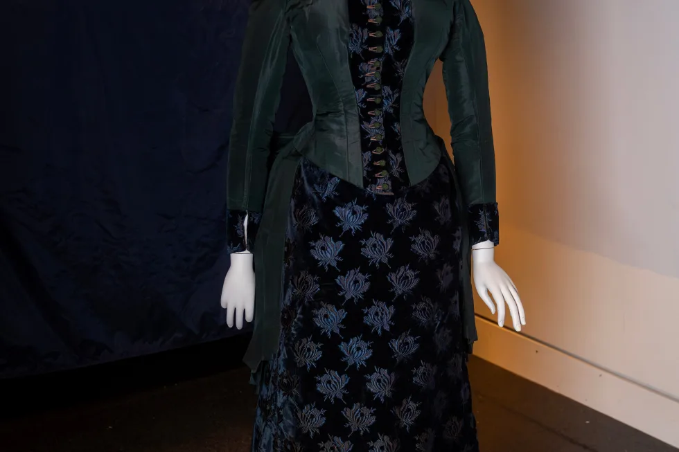 A vintage walking dress is held in preparation for The Metropolitan Museum of Art’s spring exhibition, “Costume Art,” on Thursday, Feb. 12, 2026, in New York. (Photo by Charles Sykes/Invision/AP)