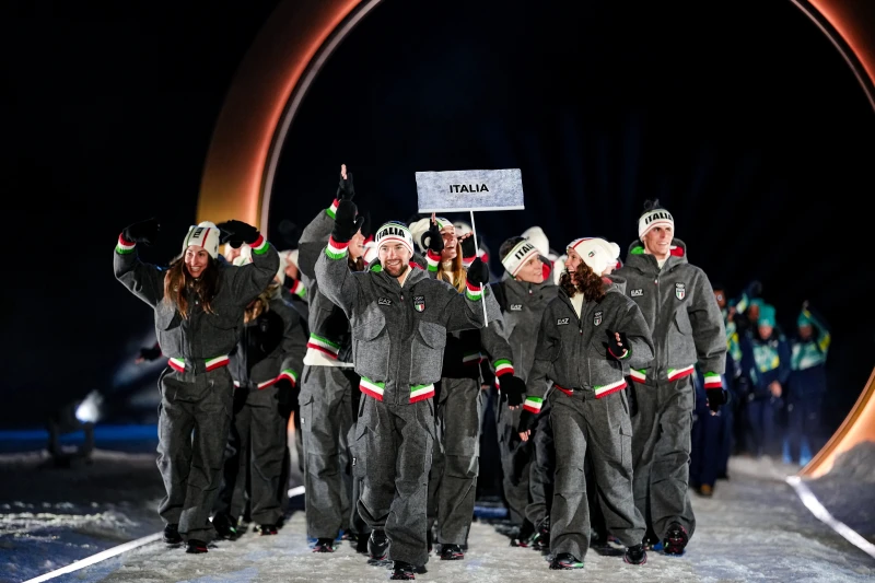 Italy athletes take part in the athletes parade during the Olympic opening ceremony at the 2026 Winter Olympics, in Predazzo, Italy, Friday, Feb. 6, 2026. (AP Photo/Matthias Schrader)