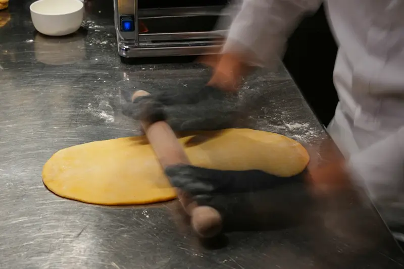 Local chef Gianluca Belli demonstrates how to make Casunziei, a type of ravioli that is Cortina’s signature dish, during a pasta-making tutorial at a Michelin one-star restaurant in Cortina D’Ampezzo, Friday, Nov. 21, 2025. (AP Photo/Andrew Medichini)