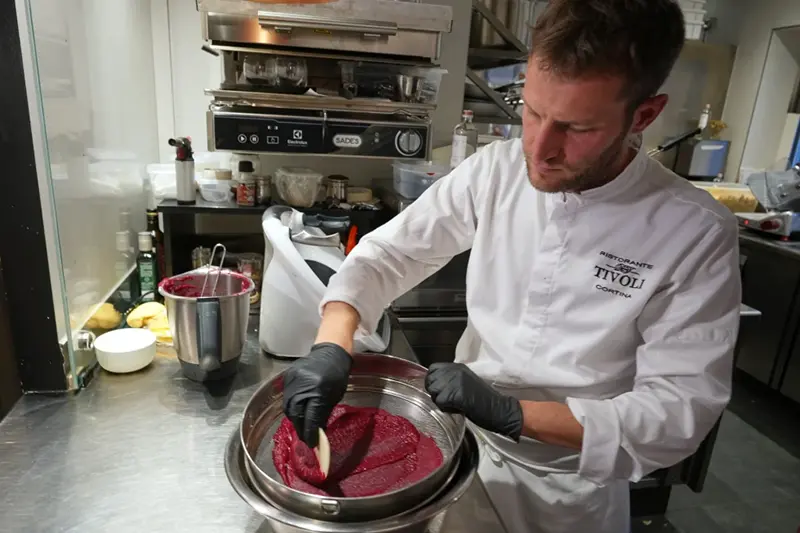 Local chef Gianluca Belli demonstrates how to make Casunziei, a type of ravioli that is Cortina’s signature dish, during a pasta-making tutorial at a Michelin one-star restaurant in Cortina D’Ampezzo, Friday, Nov. 21, 2025. (AP Photo/Andrew Medichini)