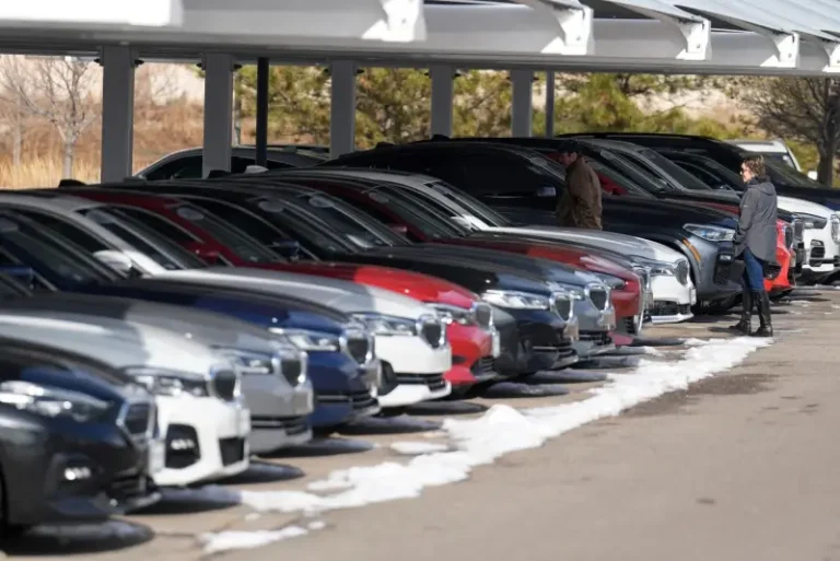 Unsold 2023 and 2024 models sit on display outside a BMW dealership on Thursday, Nov. 30, 2023, in Loveland, Colo. (AP Photo/David Zalubowski, File)