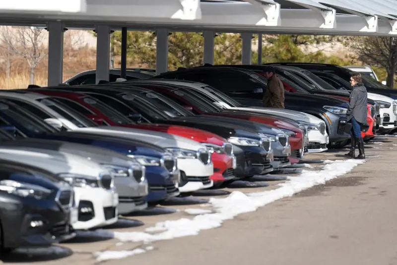 Unsold 2023 and 2024 models sit on display outside a BMW dealership on Thursday, Nov. 30, 2023, in Loveland, Colo. (AP Photo/David Zalubowski, File)