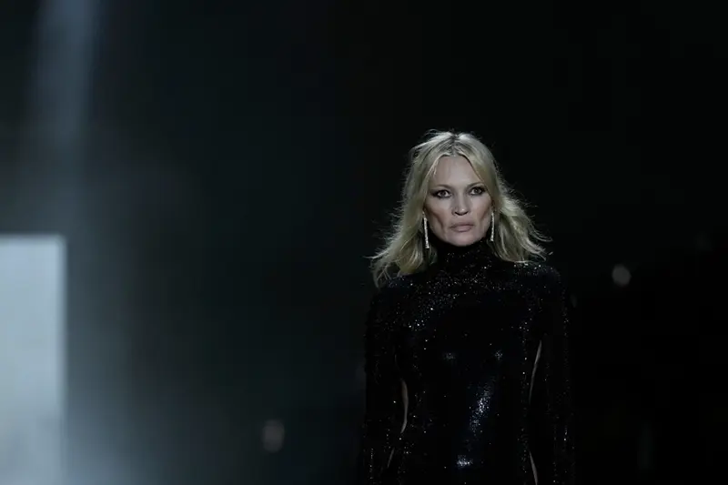 Kate Moss wears a creation from the Gucci Fall/Winter 2026-2027 Men/Women’s collection, presented in Milan, Italy, Friday, Feb. 27, 2026. (AP Photo/Luca Bruno)