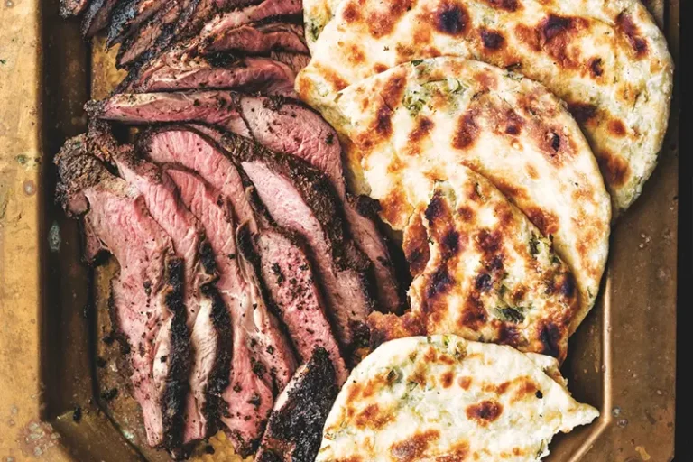 This image released by Voracious shows a recipe for grilled leg of lamb from the cookbook “Repertoire” by Jessica Battilana. (Ed Anderson/Voracious via AP)