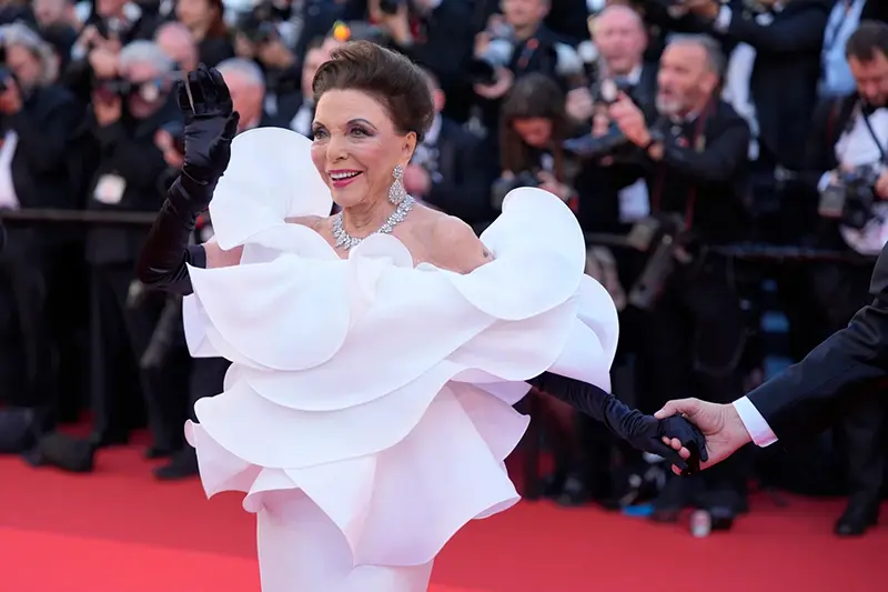 Joan Collins poses for photographers at the opening ceremony and premiere of the film ‘The Electric Kiss’ during 79th international film festival, Cannes, southern France, Tuesday, May 12, 2026. (AP Photo/John Locher)