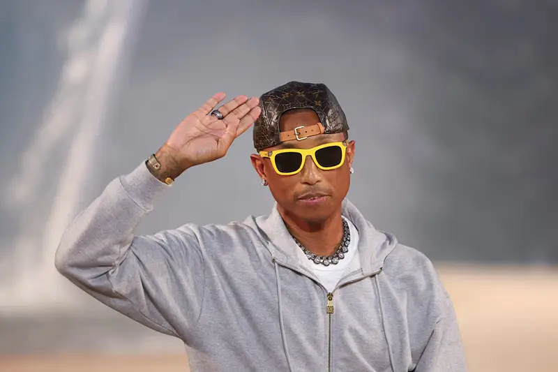 Designer and musician Pharrell Williams appears at the end of his Menswear Spring-Summer 2027 collection show for fashion house Louis Vuitton during Men's Fashion Week in Paris, France, June 23, 2026. REUTERS/Gonzalo Fuentes