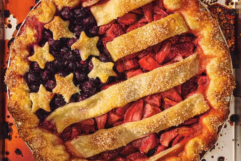 This image released by Voracious shows a recipe called stars and stripes pie from the cookbook “50 Pies, 50 States: An Immigrant’s Love Letter to the United States Through Pie” by Stacey Mei Yan Fong. (Voracious via AP)