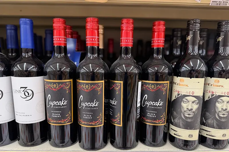 A variety of California red wines from Line 39, from left, Cupcake Vineyards and Snoop Dogg’s 19 Crimes Cali Red, are displayed at a grocery store in Concord, N.H. on June 8, 2026. (J.M. Hirsch via AP)