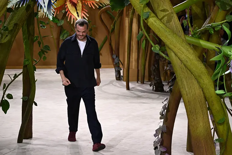 Designer Matthieu Blazy accepts applause after the Chanel Haute Couture Fall/Winter 2026-2027 Women’s collection presented in Paris, Tuesday, July 7, 2026. (AP Photo/Emma Da Silva)