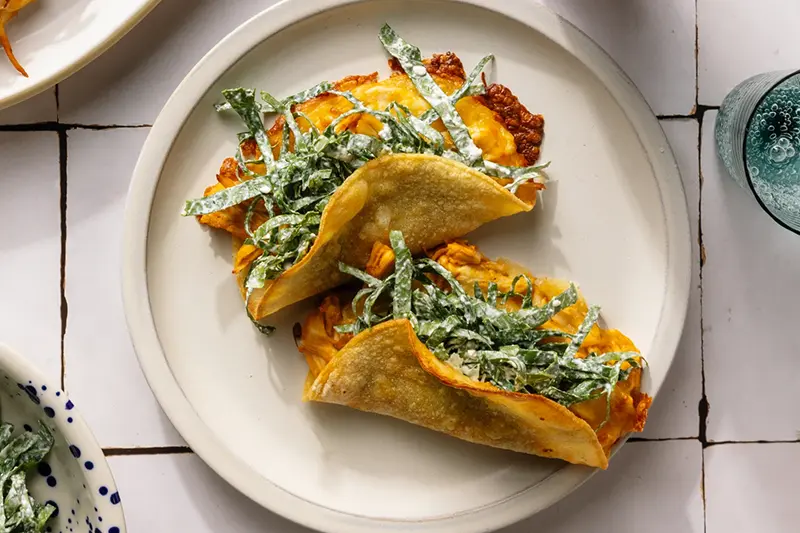 This image released by Voracious shows a recipe for chicken tacos from the cookbook “The Protein Meal Prep Plan” by Cassy Joy Garcia. (Alanna Hale/Voracious via AP)