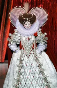 Host Whoopi Goldberg appears as Queen Elizabeth, in a Bob Mackie costume, during the 71st Annual Academy Awards in Los Angeles on March 21, 1999. (AP Photo/Eric Draper, File)