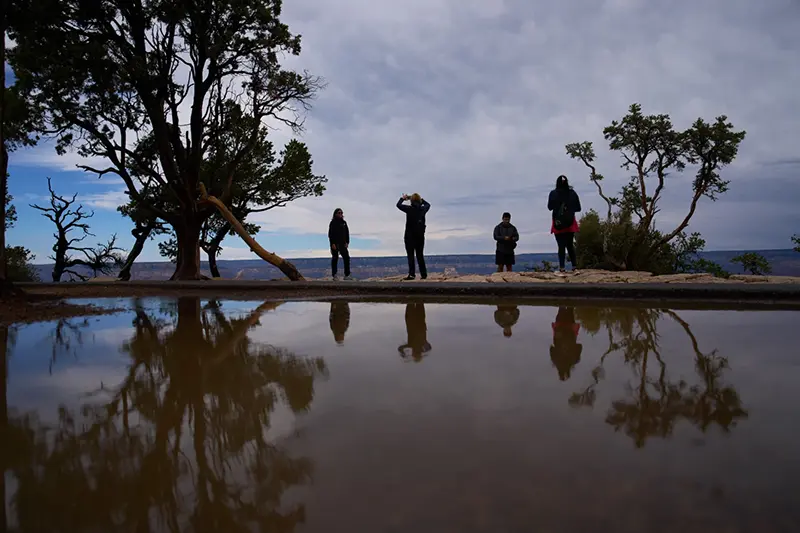 People stand at the rim of the Grand Canyon, Monday, Aug. 31, 2026, in Grand Canyon National Park, Ariz. (AP Photo/John Locher, File)