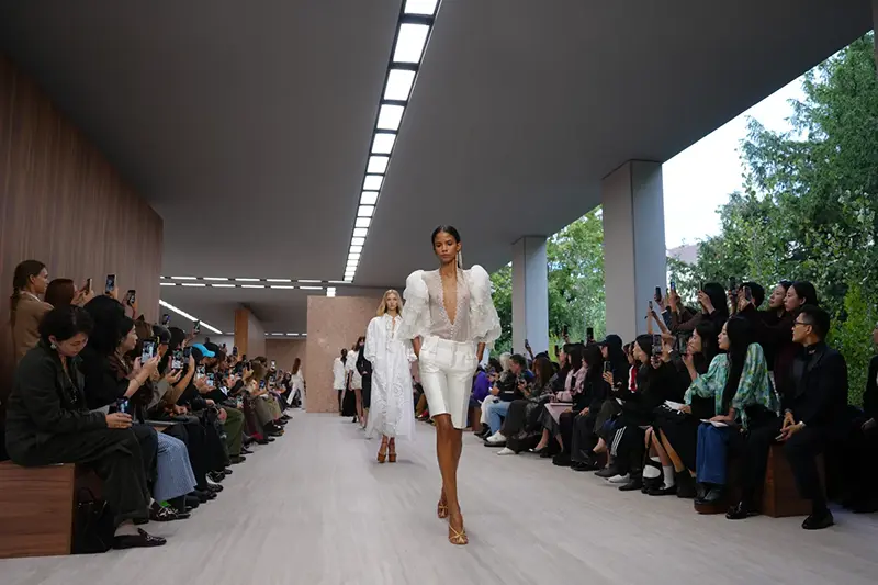 Models wear creations as part of the Chloe Womenswear Spring Summer 2027 collection presented in Paris, France, Thursday, Oct. 1, 2026. (AP Photo/Aurelien Morissard)