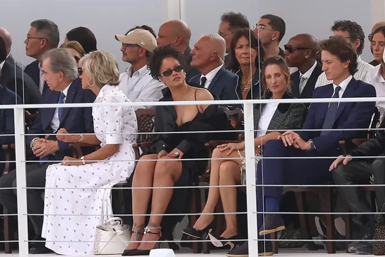 Rihanna, centre, and Camille Cottin, centre right, watch the Christian Dior Womenswear Spring Summer 2027 collection presented in Paris, France, Tuesday, Sept. 29, 2026. (AP Photo/Thomas Padilla)