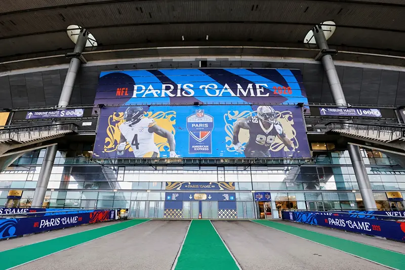 An exterior view of the Stade de France with NFL branding on Thursday, Oct. 22, 2026, in Saint-Denis, north of Paris, ahead of Sunday’s game between the Pittsburgh Steelers and the New Orleans Saints. (AP Photo/Greg Payan)