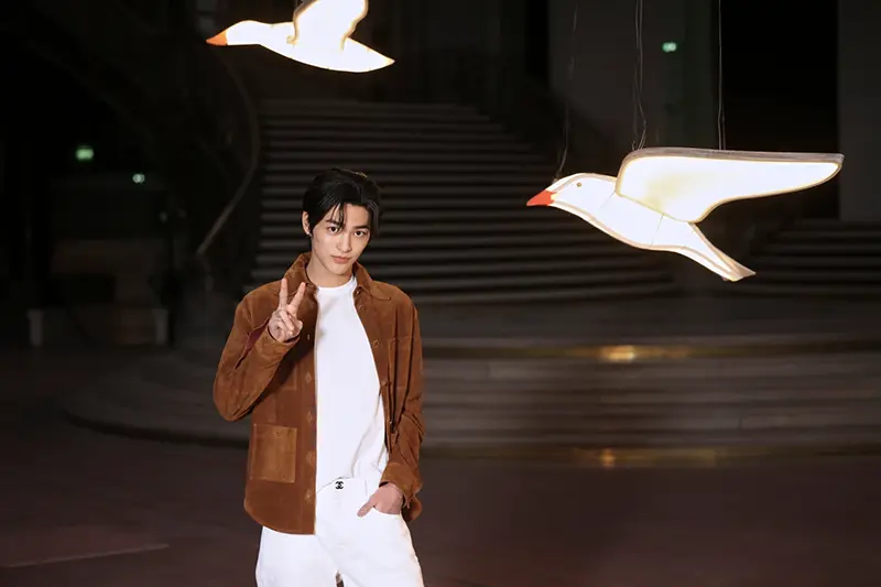 Keonho poses upon arrival at the Chanel Womenswear Spring Summer 2027 collection presented in Paris, France, Monday, Oct. 5, 2026. (AP Photo/Thomas Padilla)